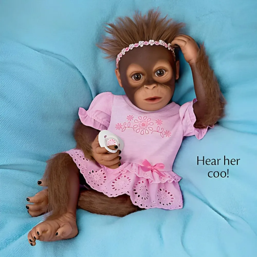 The Ashton - Drake Galleries Cooing Cora Baby Girl Monkey Doll Coos and Breathes So Truly Real® Lifelike Hand Applied Mohair RealTouch® Vinyl Skin Fully Weighted and Poseable for Realism 18-inches