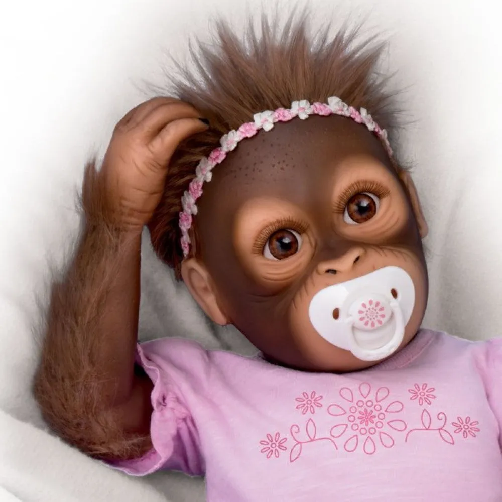 The Ashton - Drake Galleries Cooing Cora Baby Girl Monkey Doll Coos and Breathes So Truly Real® Lifelike Hand Applied Mohair RealTouch® Vinyl Skin Fully Weighted and Poseable for Realism 18-inches