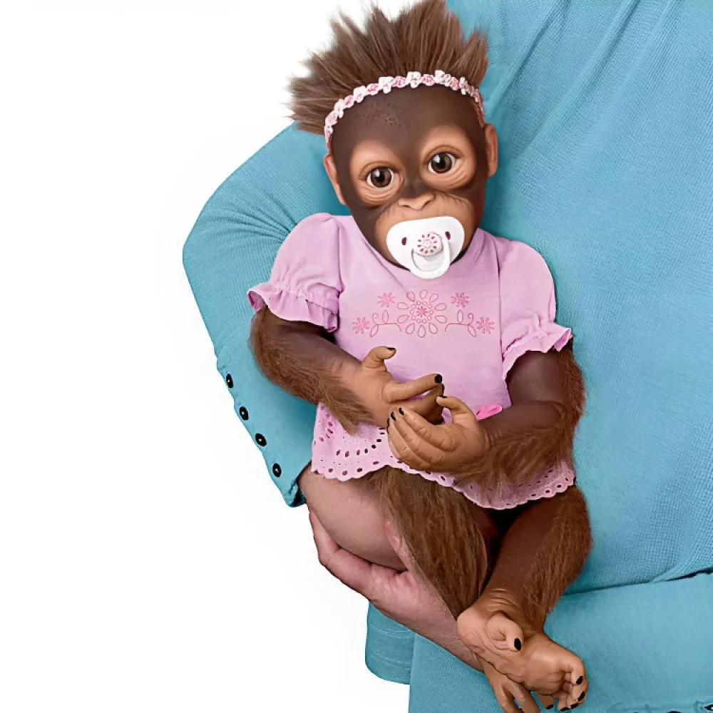 The Ashton - Drake Galleries Cooing Cora Baby Girl Monkey Doll Coos and Breathes So Truly Real® Lifelike Hand Applied Mohair RealTouch® Vinyl Skin Fully Weighted and Poseable for Realism 18-inches